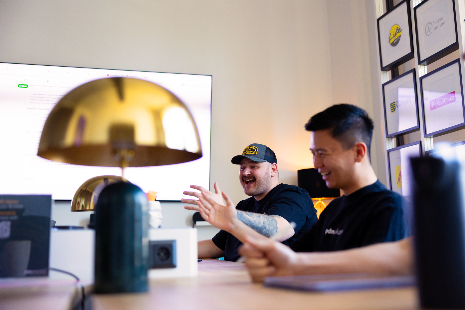 A render of three white cylindrical columns, against a warm creme background
